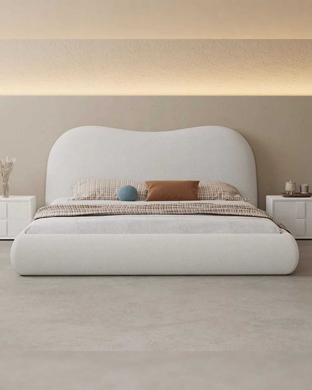 Front view of Bargrove arched back low profile bed with pale boucle finish