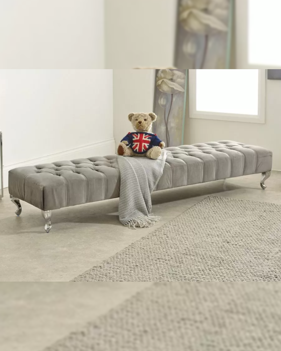 Dunmoor footstool with extra-long buttoned velvet top and curved metal legs styled with throw and cushion