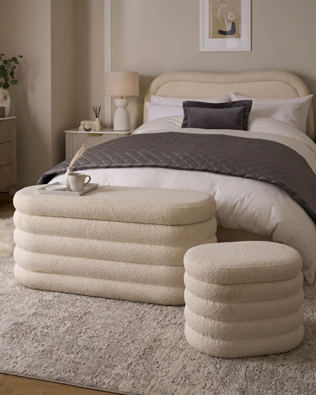 Bedroom view showing Ravenbury soft sculptural ottoman box with layered curved design.