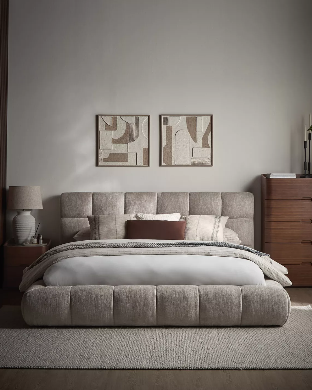 Redbourne padded low grid tufted bed in a warm neutral bedroom setting