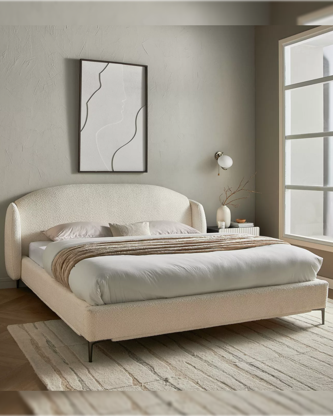 Silleigh modern arched back minimal bed styled in a light neutral bedroom