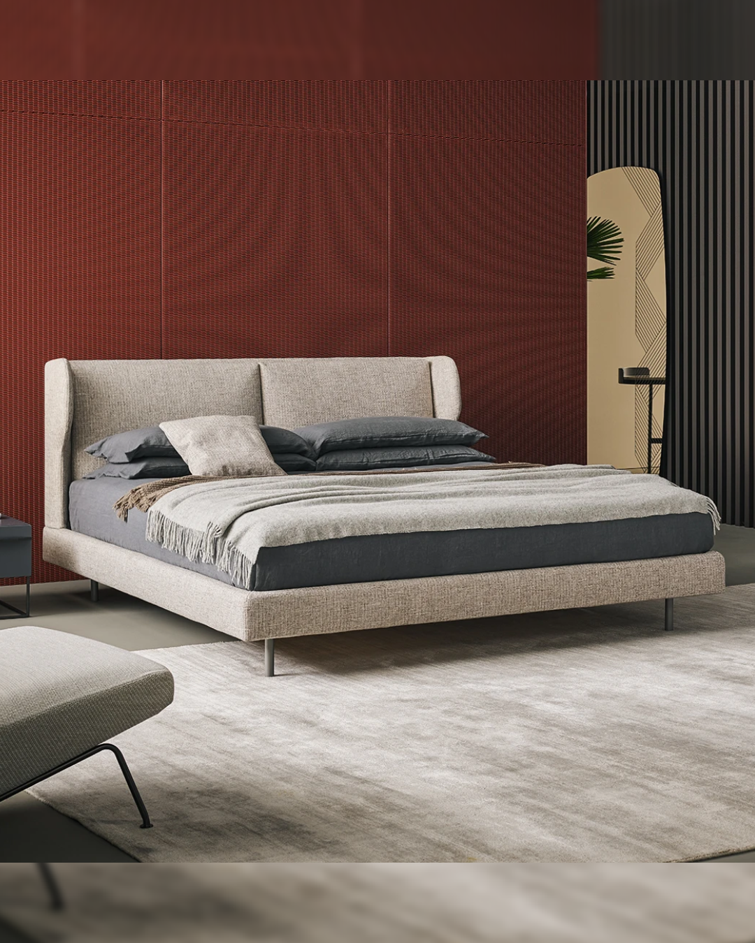 Room view of Silmere bed with curved backrest and slim floating frame