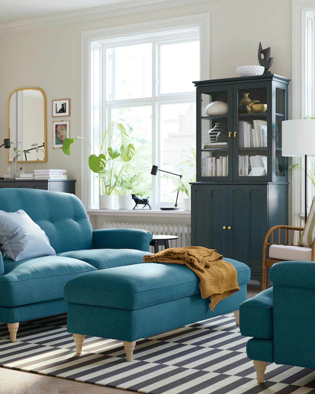 Full view of Isenridge teal upholstered ottoman box with light wood legs.